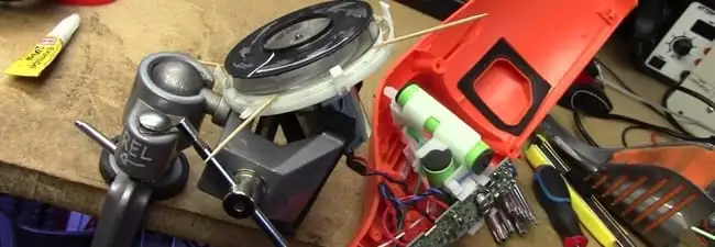 Vacuum cleaner repair parts and tools on a workbench in Cedar Rapids, IA